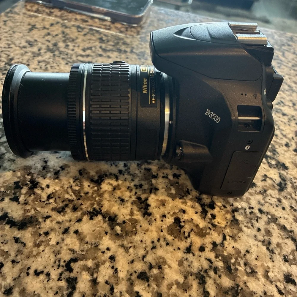 Nikon Black Digital Camera with Ergonomic Design and Professional Lens